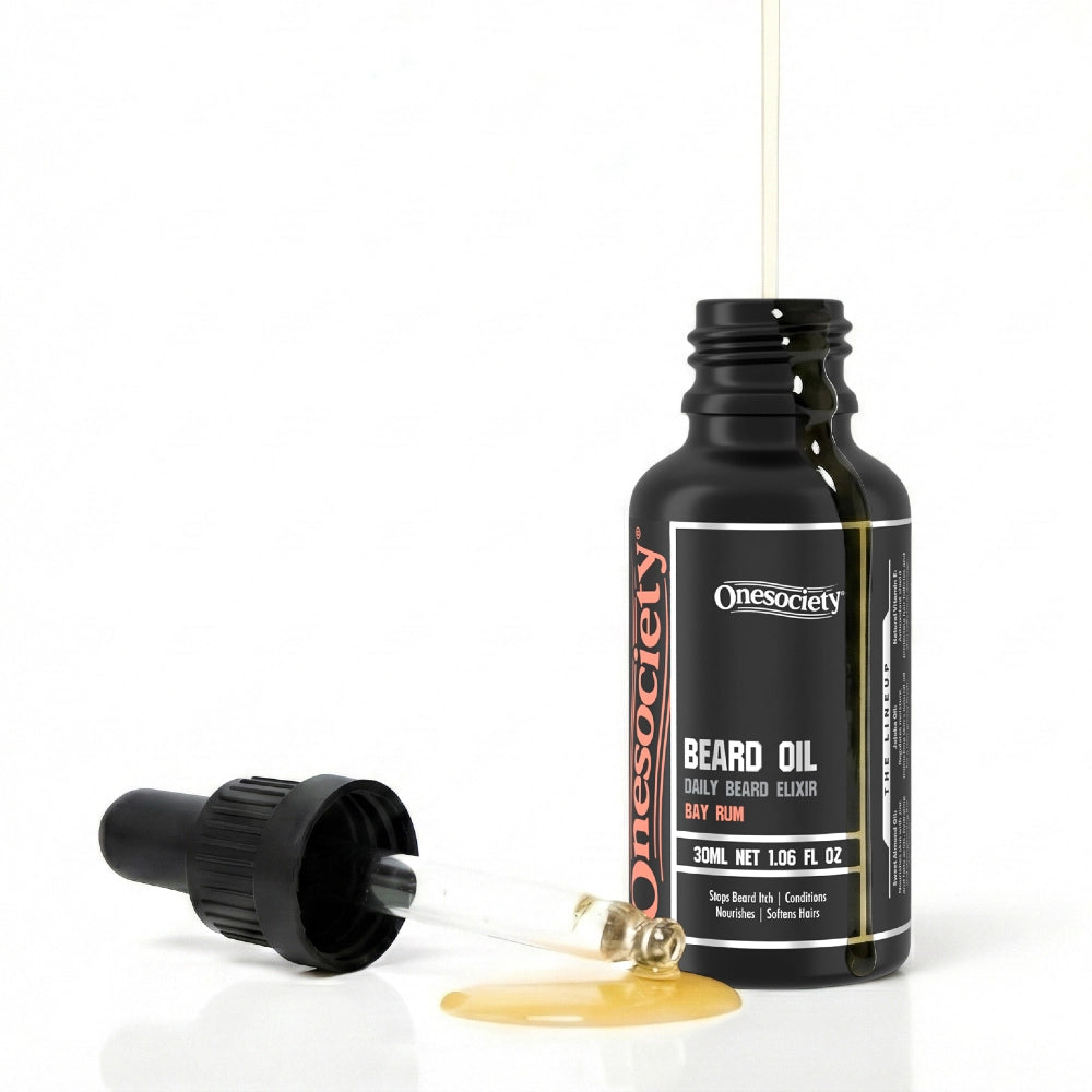 Bay rum beard oil by one society with pipette off and oil spilling
