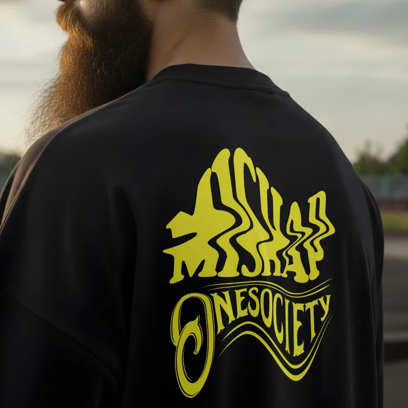 Person wearing a black jacket with yellow 'Onesociety' logo