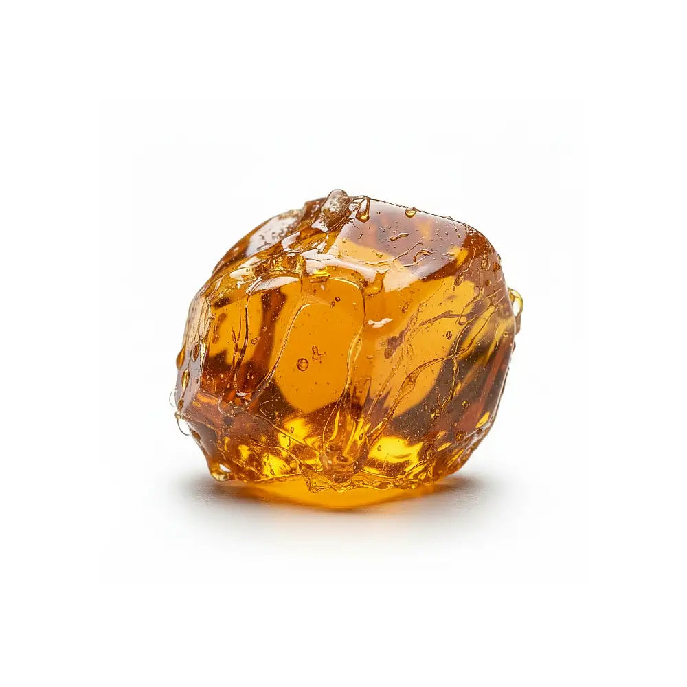 Large amber pine rosin on a white background