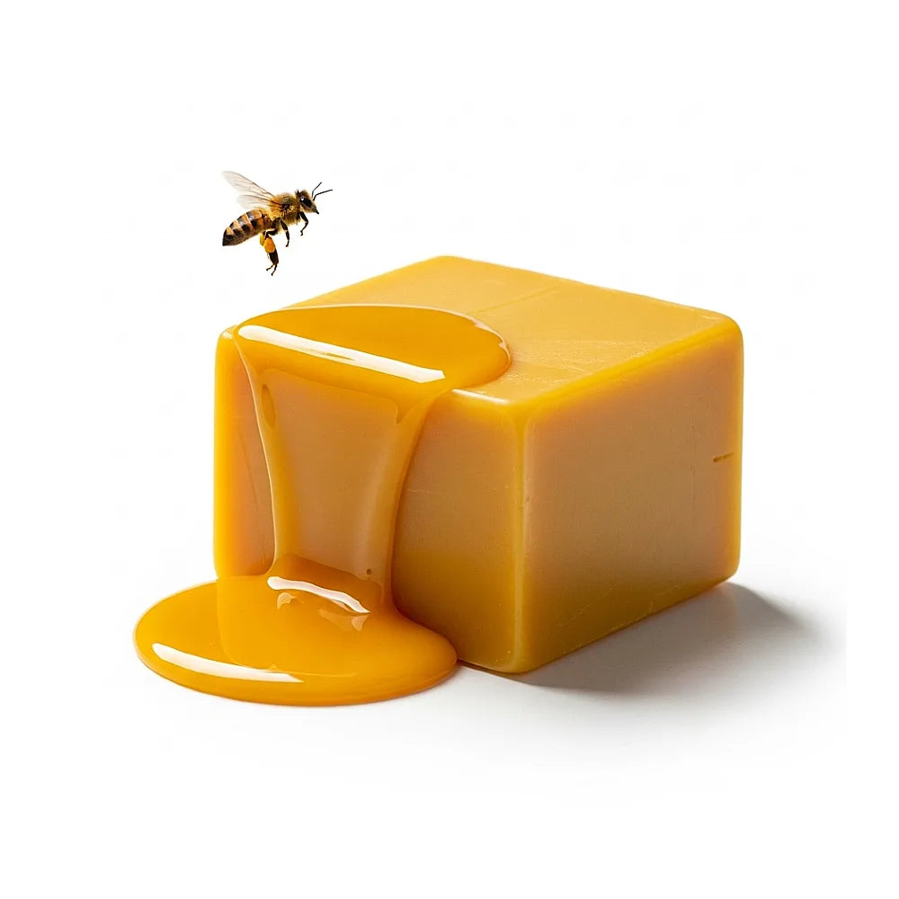 Cube of beeswax with a bee on a white background