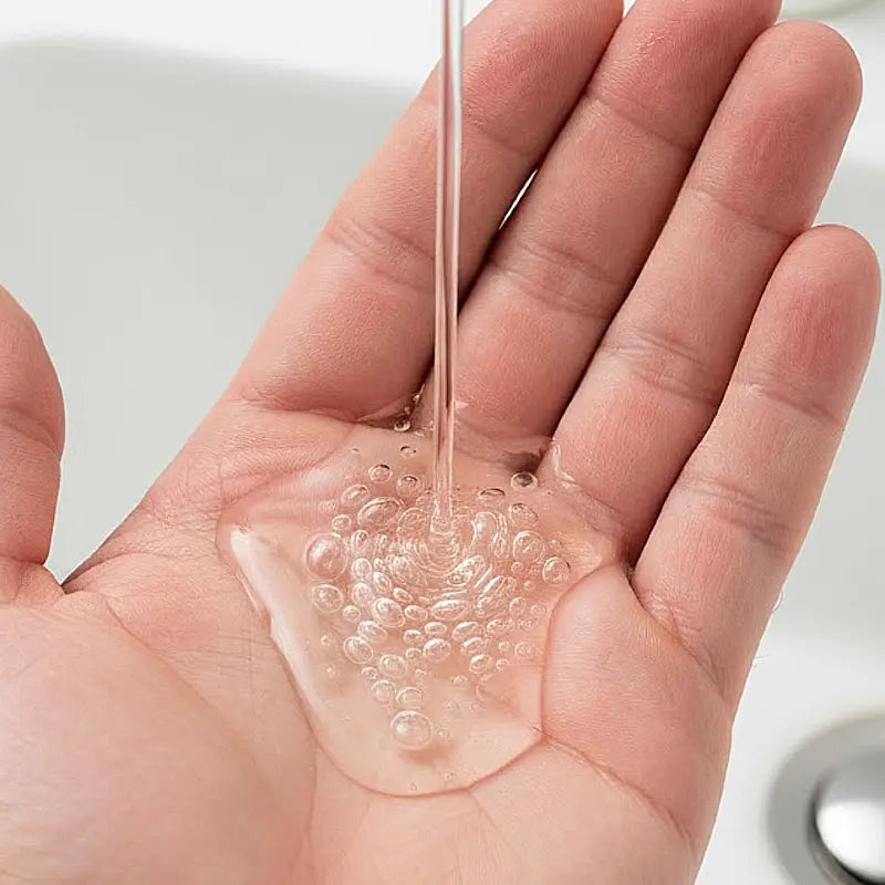 Tea tree shampoo in mans hand