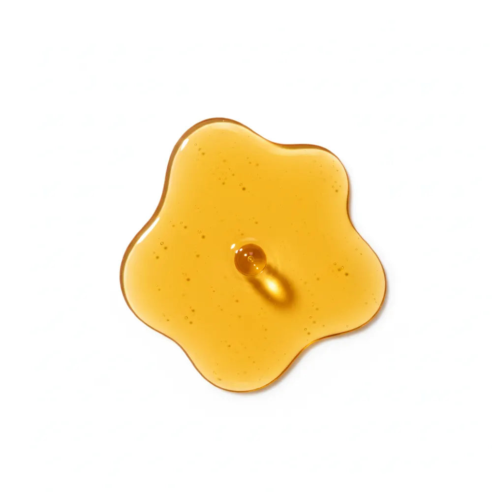 Vitamin E oil on white background