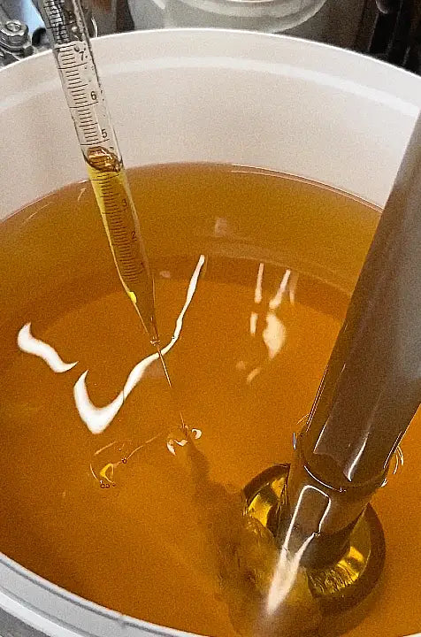 essential oils being added to beard butter mixture