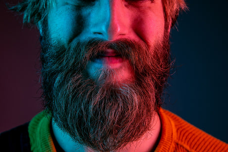 Man with Nice big beard, smiling because he uses one society beard care products.