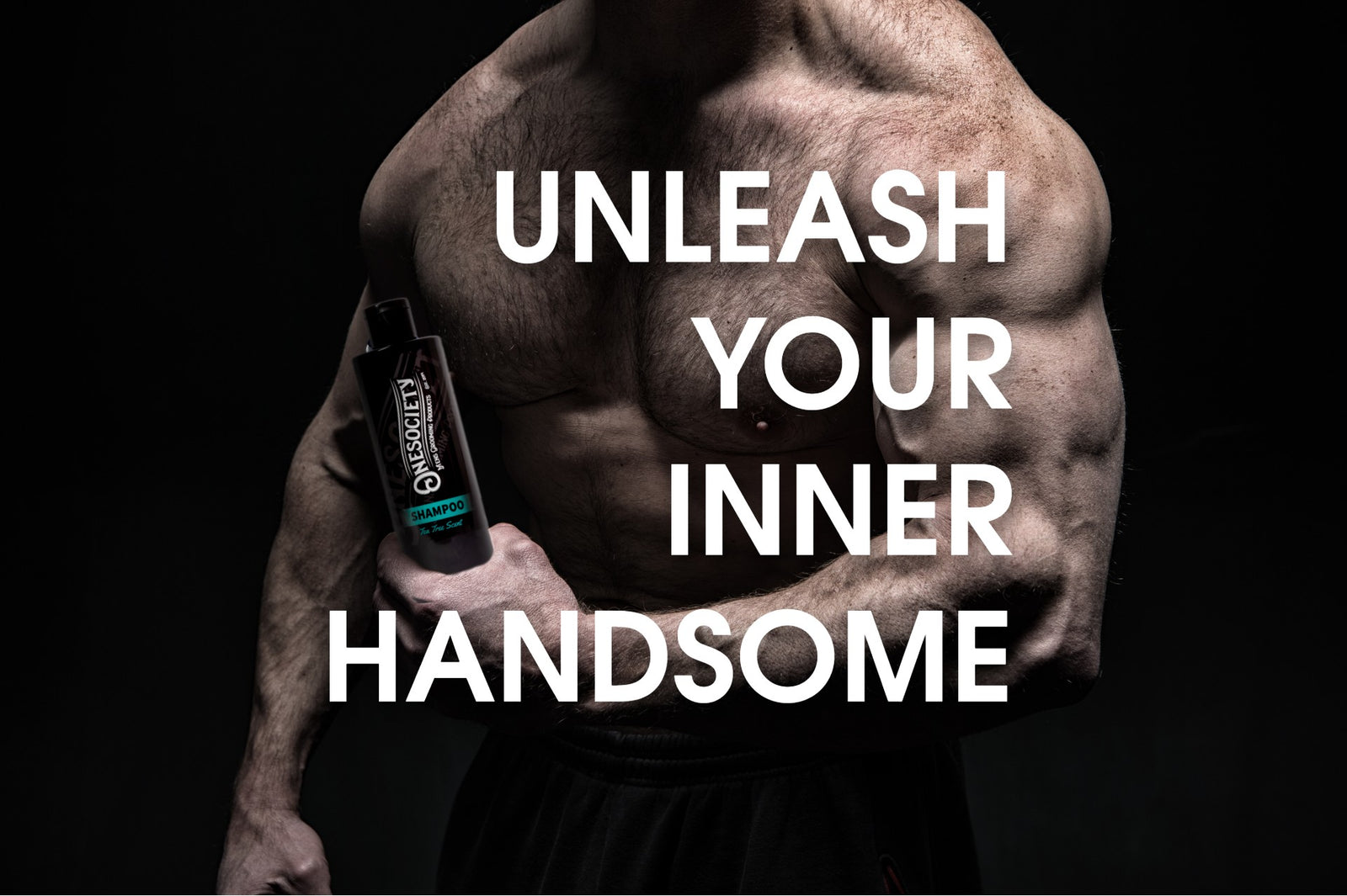 Strong man with top off exploring the world of beauty products for men holding a one society men's grooming products tea tree shampoo