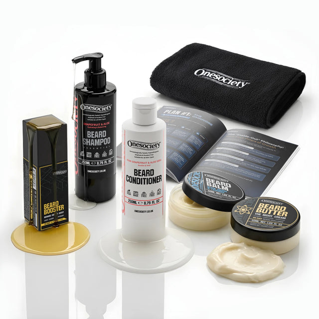 Collection of Onesociety beard care products including shampoo, conditioner, and other grooming items on a white background.