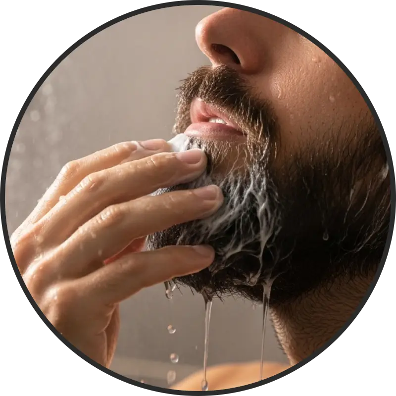 Man applying beard conditioner in the shower