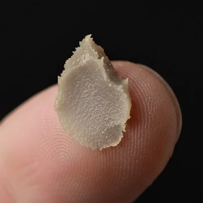 beard and moustache wax on mans finger