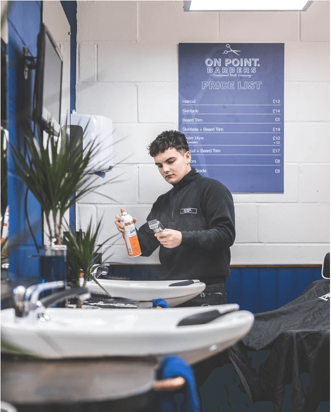 Oli Norman Spraying his barbering clippers.