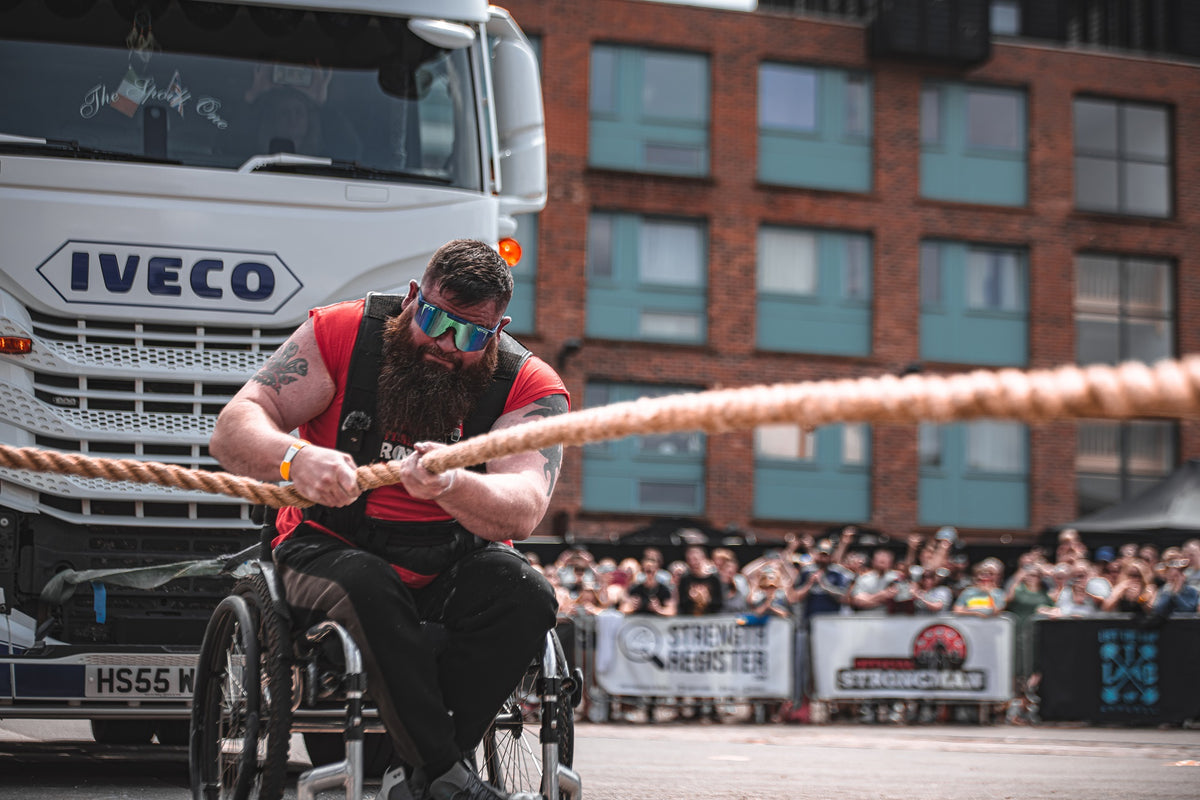 David Walsh Worlds Strongest Disabled Man pulling a truck. Onesociety One society