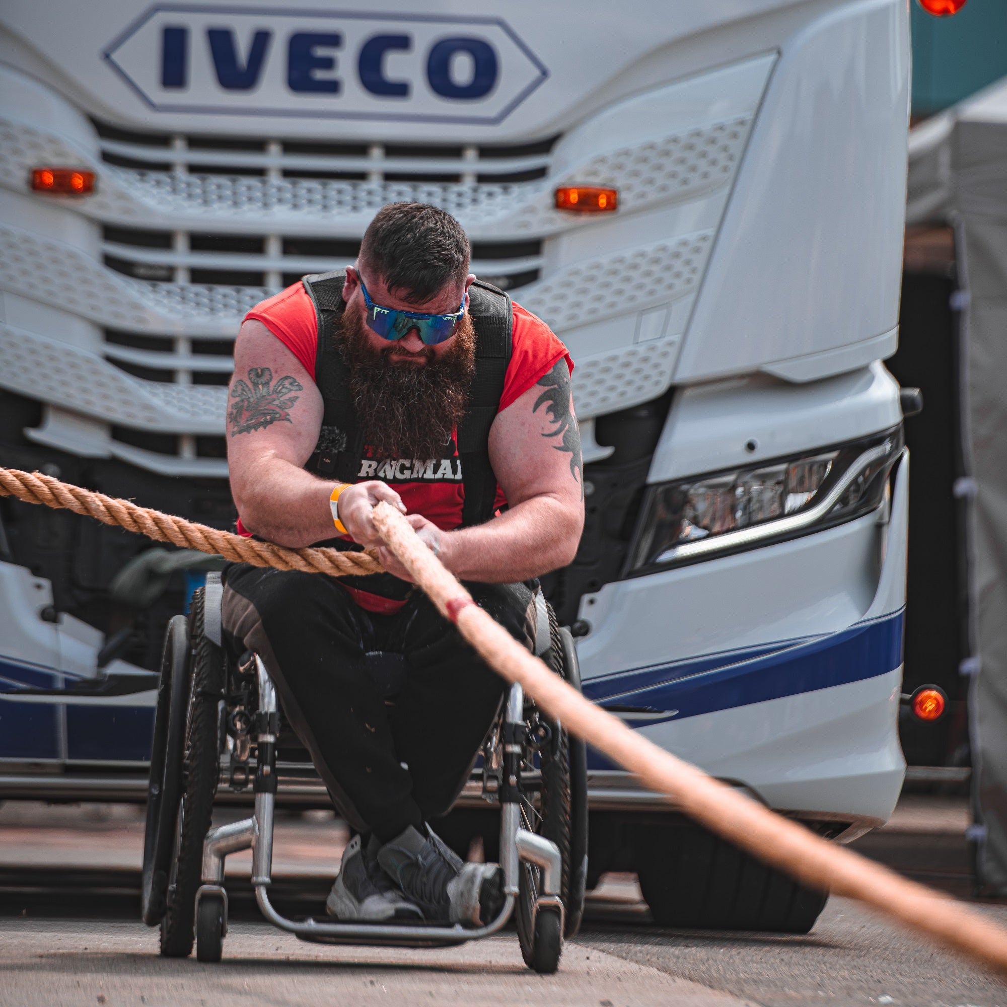 David Wlash Worlds Strongest Disabled Man pulling a truck. Onesociety One society portrait image small