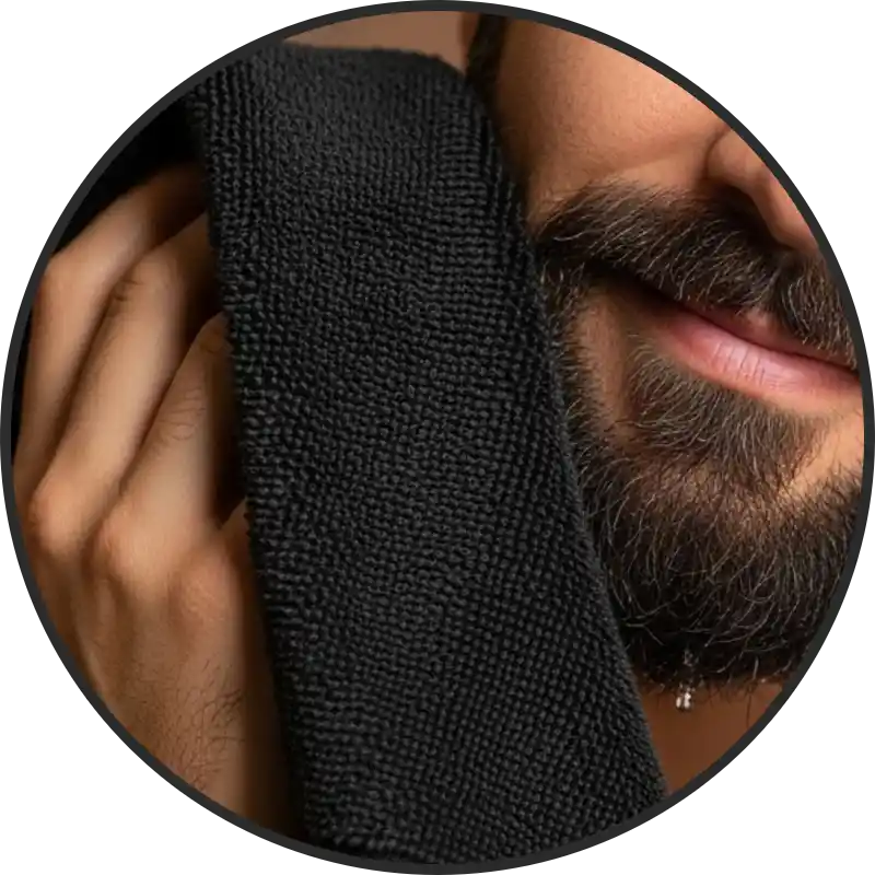 man drying beard with high quality black beard towel