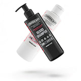 Two bottles of Onesociety pink grapefruit and aloe vera beard conditioner and beard shampoo on a white background