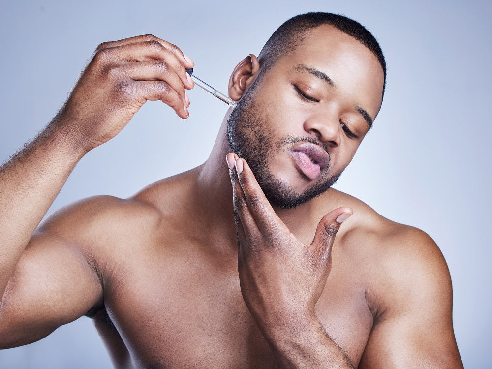 man using beard oil to help with beard itch beard growth