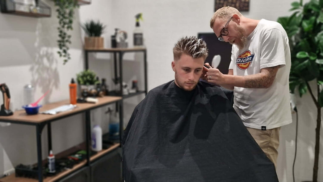 Nathan Irwin the barber cutting hair.