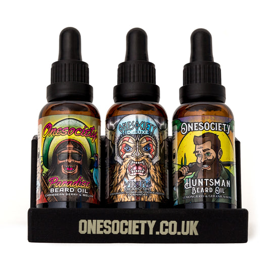 Front facing image of 3 beard oils in the one society beard oil holder, Viking, paradise and huntsman scents. Beard Oil Holder | Beard Bottle Display Stand | Made In UK | 3 Slots. Made by Onesociety.