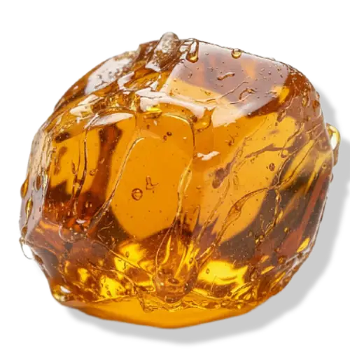 Transparent amber-coloured pine rosin on a white background