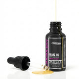 Rhubarb and vanilla beard oil by one society with pipette off and oil spilling