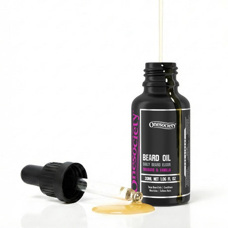 Rhubarb and vanilla beard oil by one society with pipette off and oil spilling