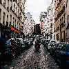 Man riding motorbike through city