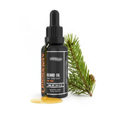 Bottle of Onesociety beard oil with a dropper next to a pine branch on a white background