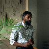 Man with Beard next to plant