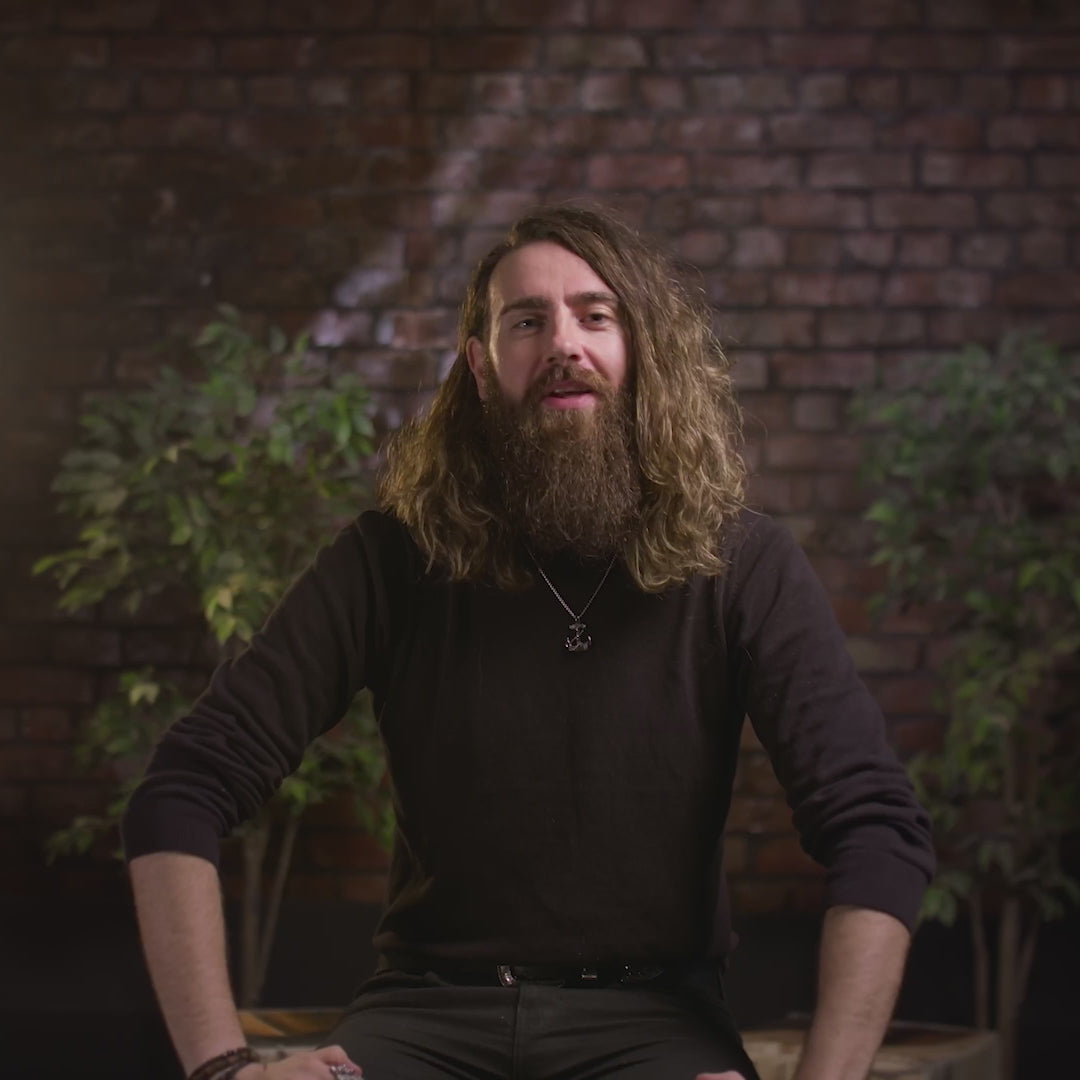 The video is about the "90-day beard challenge" and is presented by Adam Brown. Brown congratulates the viewer on the growth of their beard, noting the change from "barely anything there" a few weeks ago to "Real, proper, full-on growth" now. He tells the viewer they are "doing amazing" and "building something amazing".