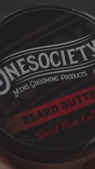 One society Beard Butter Being used by a barber, great for stumlating beard growth and a healthier thicker beard. Made in the UK with natural vegan ingredients, made for men.