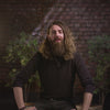 The video features the "90-day beard challenge" presented by Adam Brown. The speaker notes that the beard may be feeling thicker and less itchy. The speaker confirms that the viewer is sticking to the challenge and doing well, being 30 days in.