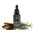 Black beard oil bottle with herbs and spices on a white background
